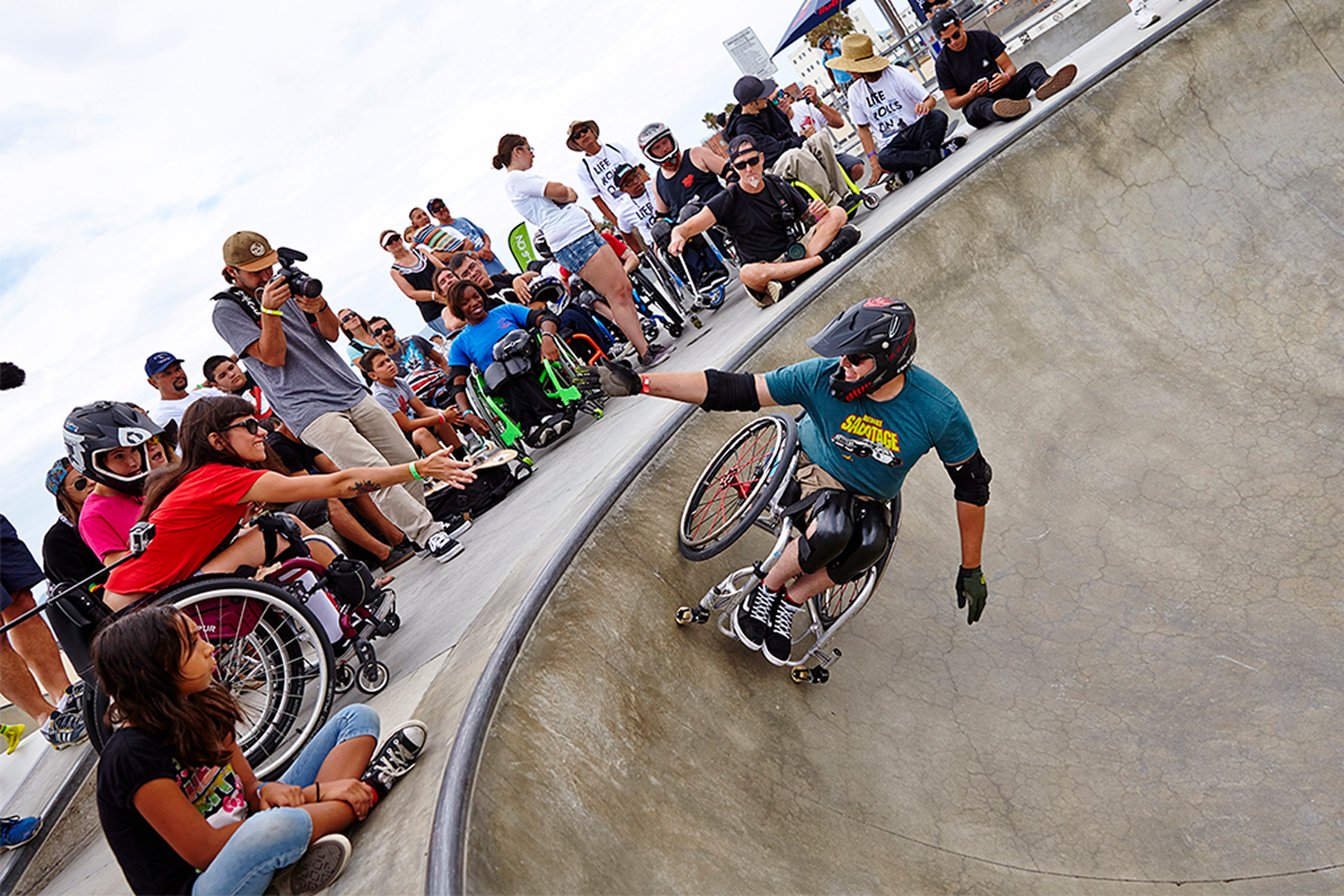 Wheelchair skater in bowl